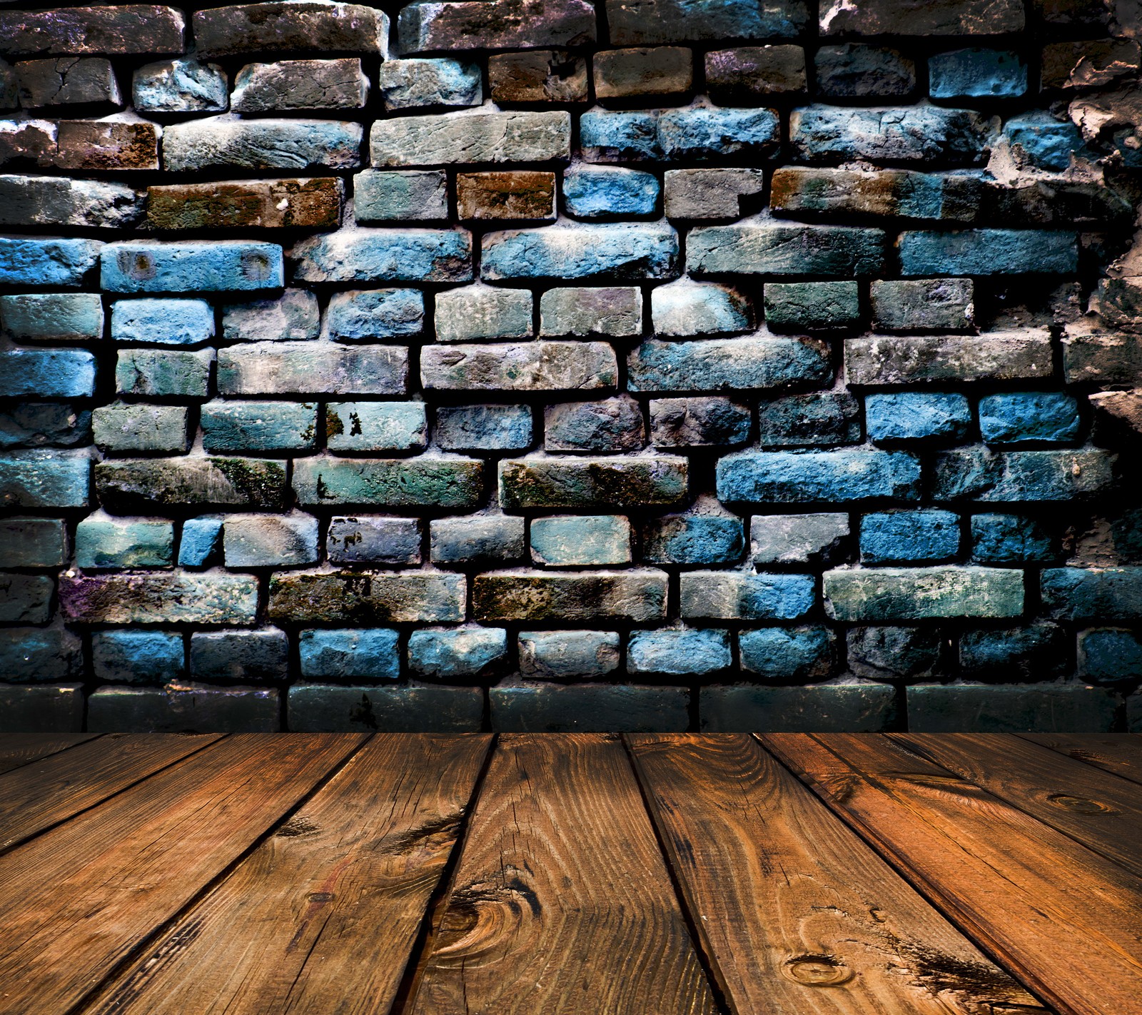 A wooden floor with a brick wall in the background (colored bricks wall, planks background)