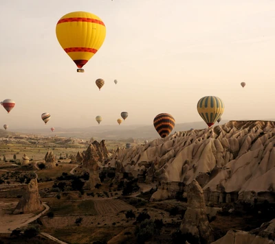 Hot Air Balloons Over Majestic Mountains at Dawn