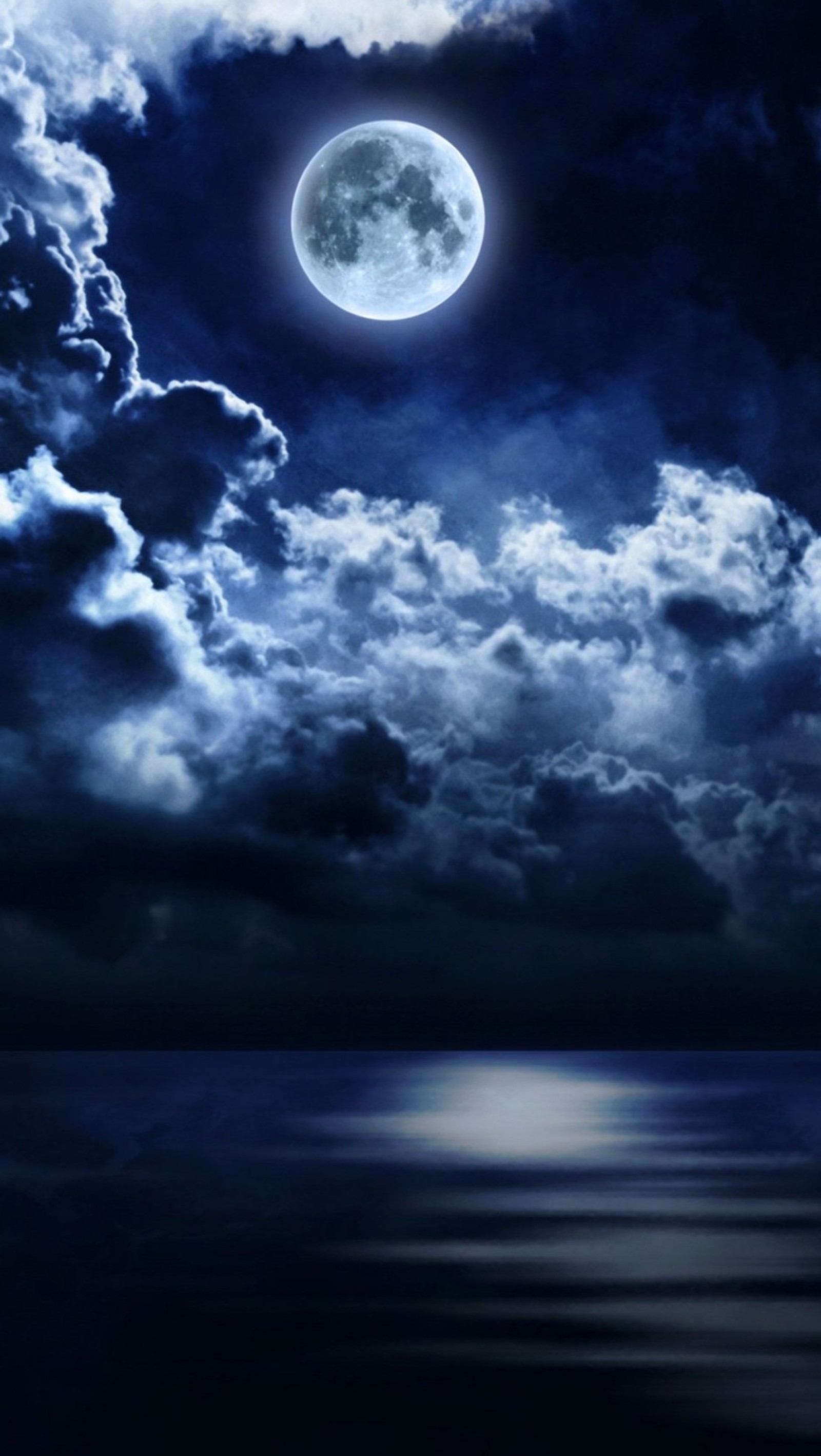 A close up of a full moon with clouds and water (moon, nature, night, sea)