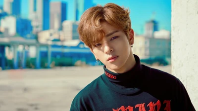 Kim Woojin of Stray Kids in a stylish urban setting.