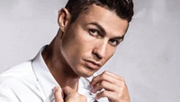 Cristiano Ronaldo posing confidently, showcasing his facial features and style in a magazine shoot.