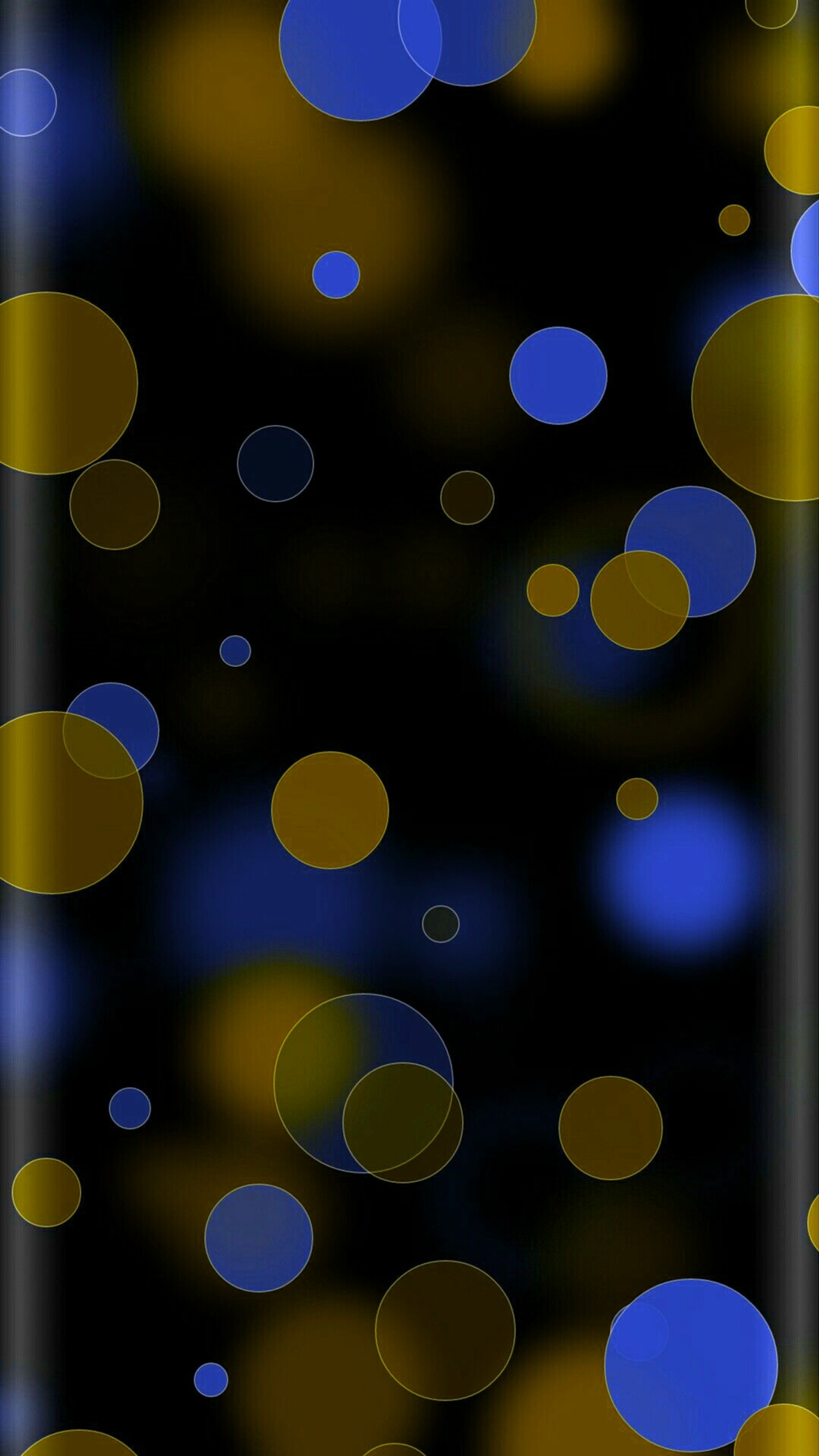 Um close de um celular com um fundo azul e amarelo (abstrato, casca, bolha, círculos, design)