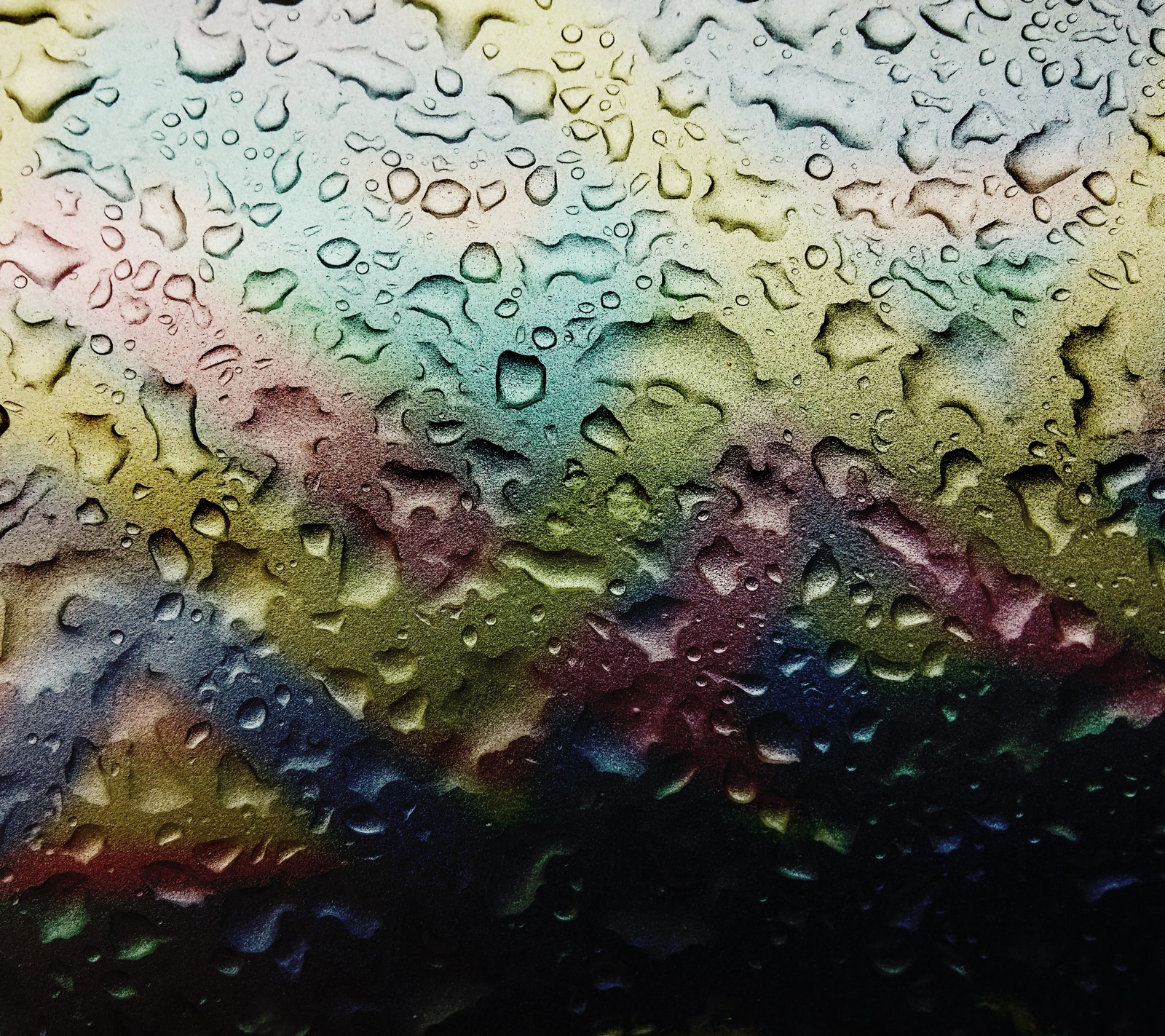 A close up of a window with rain drops on it (abstract, color, design, other, rain)