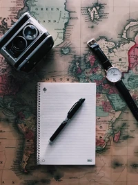 Exploring Ideas: A Vintage Map, Notebook, and Camera