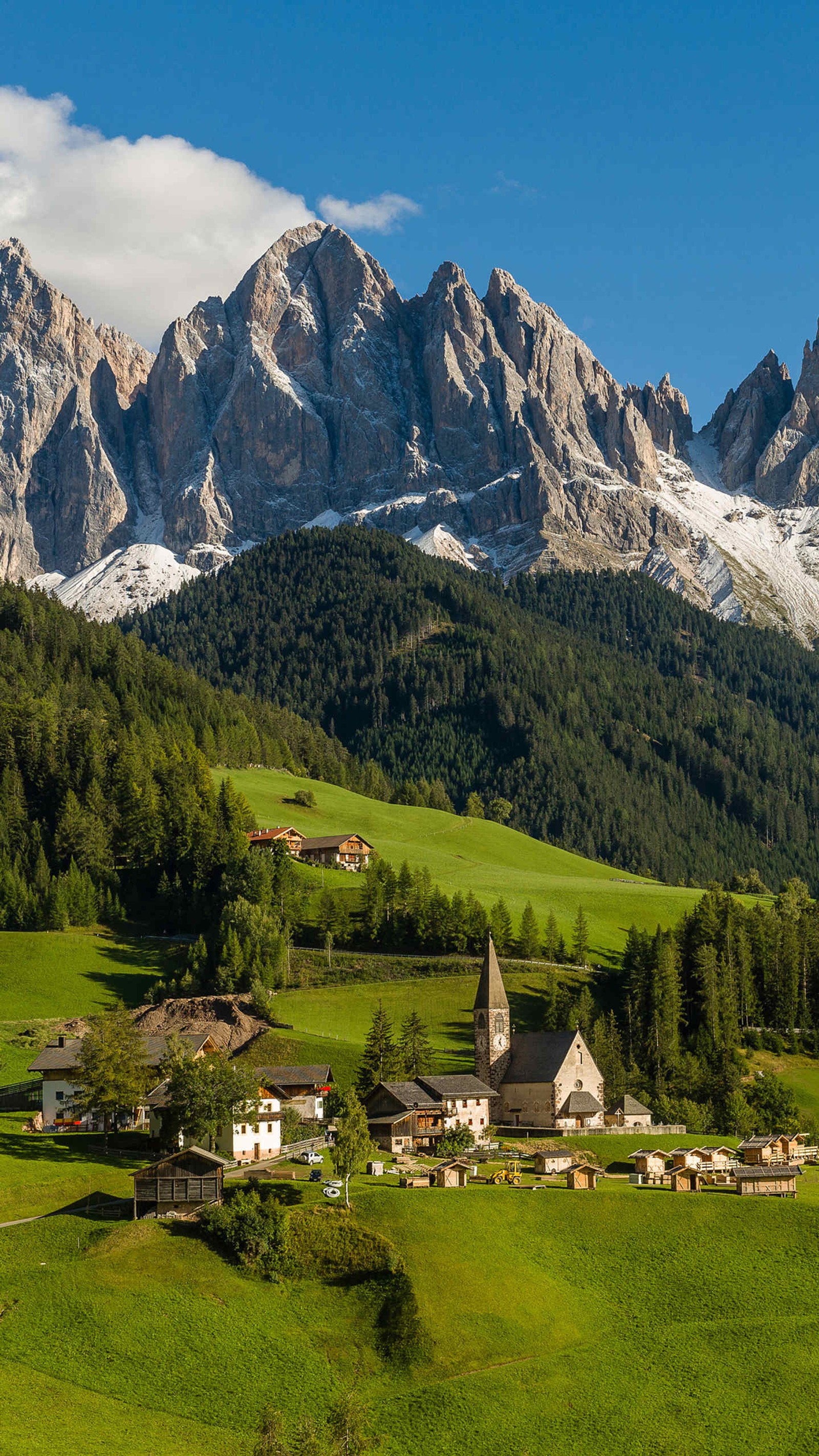 Mountains in the distance with a small village in the foreground (alpler, alps, mountain, ranch, view)