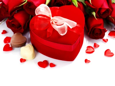 Regalo del Día de San Valentín: Caja de chocolates en forma de corazón rodeada de rosas rojas