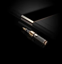 Elegant Fountain Pen Beside a Huawei Smartphone in Dark Setting