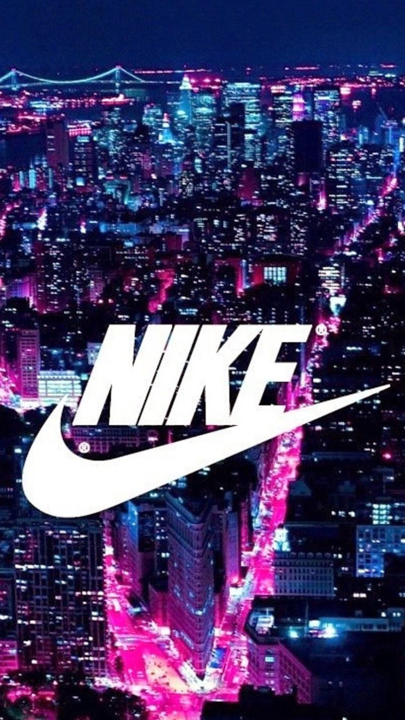 Вид на город ночью с большим логотипом nike (воздух, blu and pink, город, делать, просто)