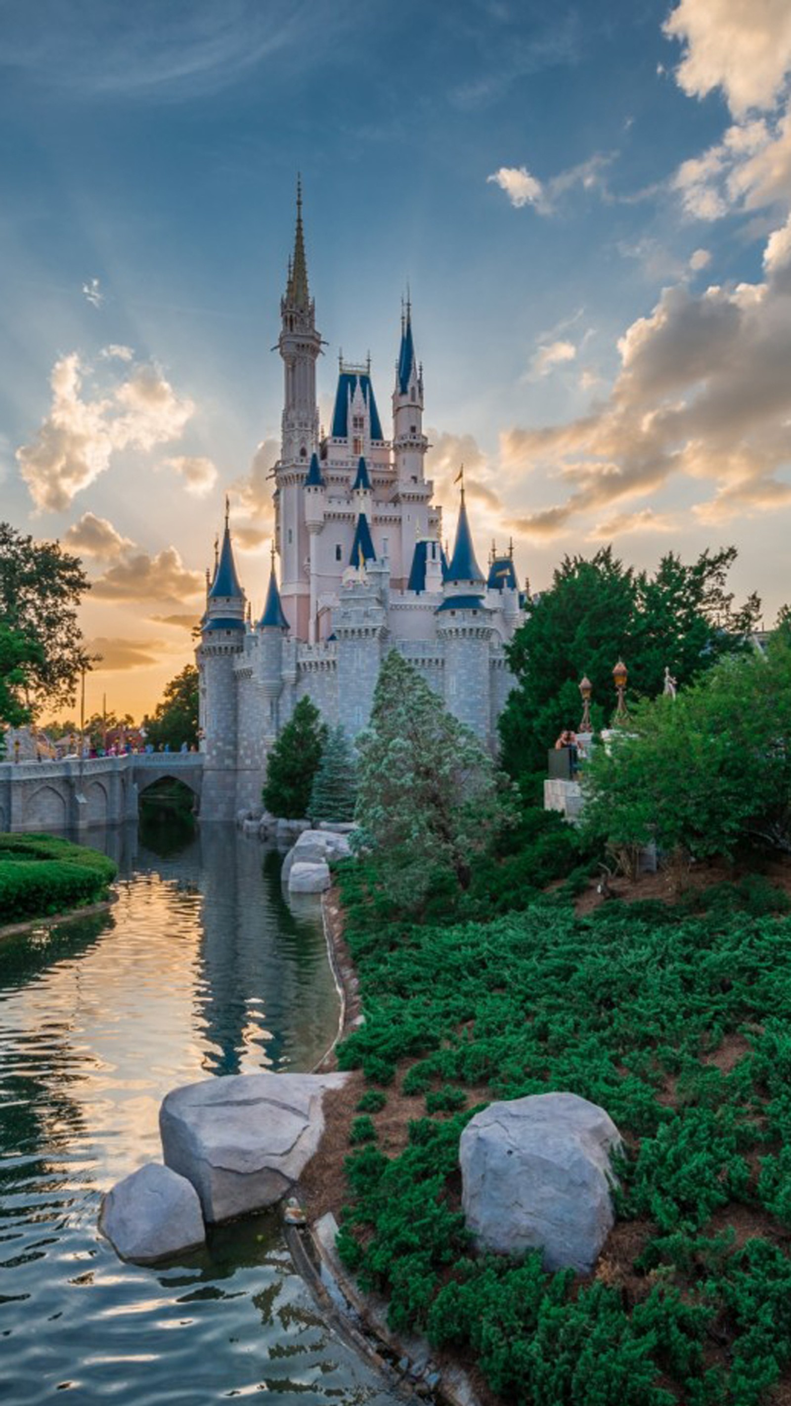 Arafed castle with a bridge and a river in front of it (castle, cinderella, disney world, walt disney world)