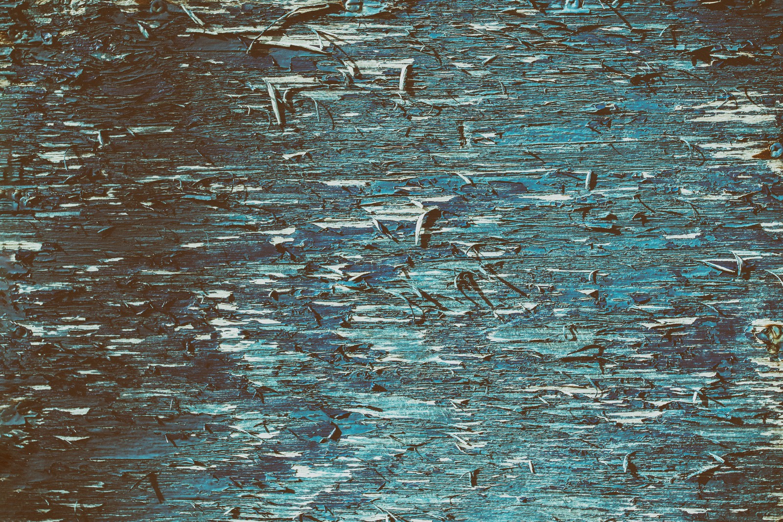 A close up of a blue and black paint textured wall (wood, wall, texture, paint, tree)