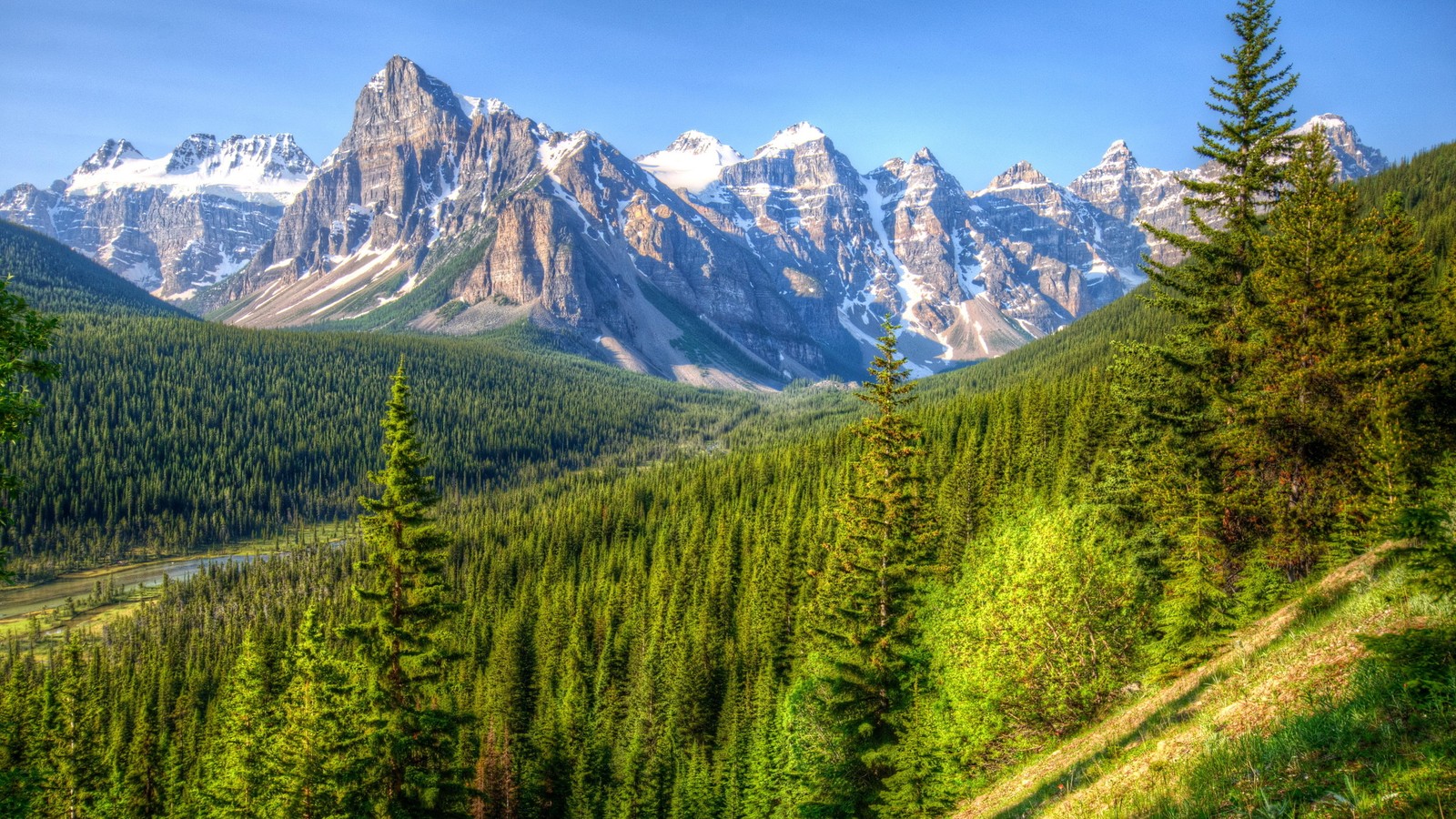 A view of a mountain range with a river and trees (moraine lake, mountainous landforms, mountain, nature, wilderness)