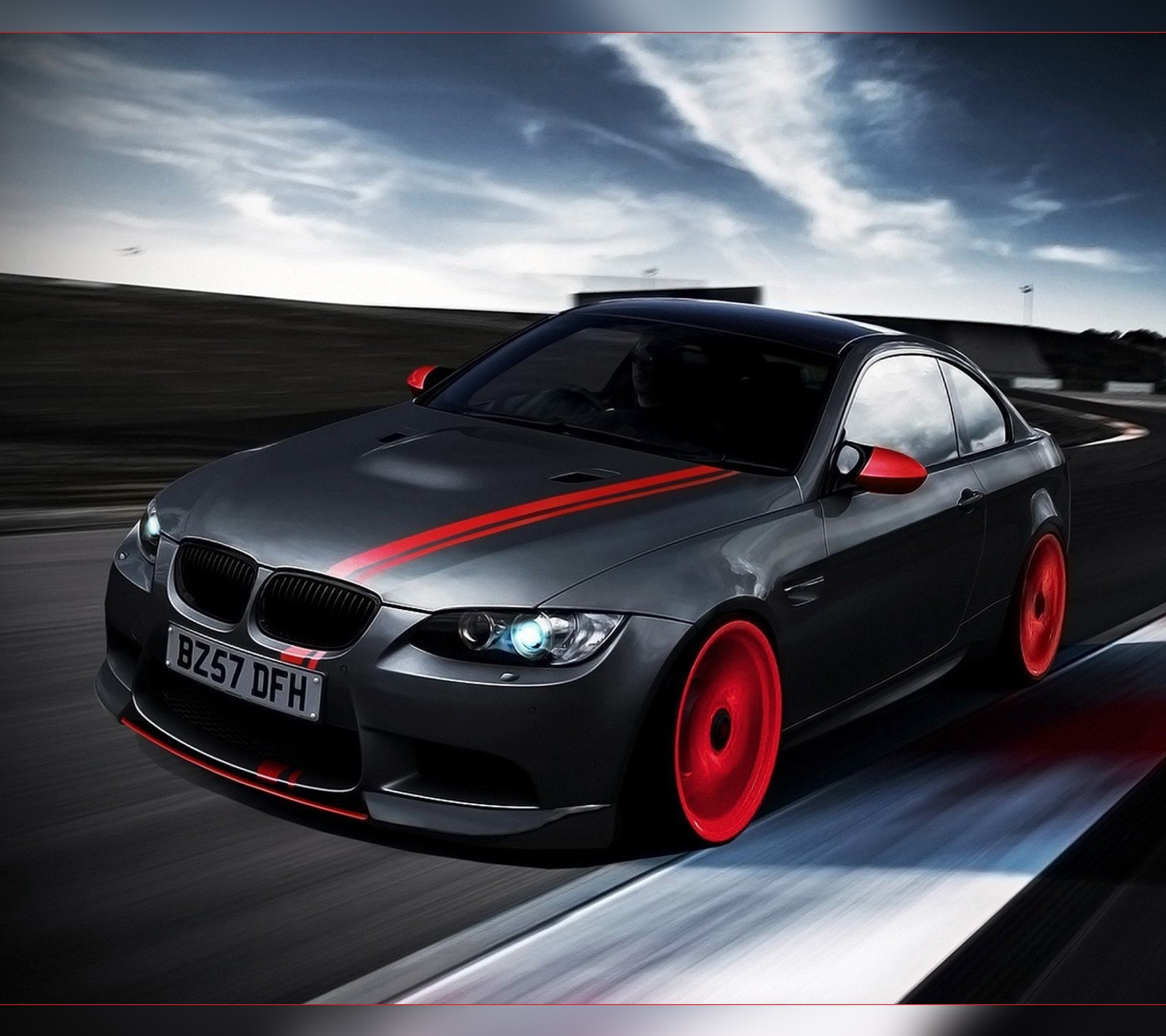 A close up of a car driving on a road with a sky background (bmw, car, coupe, e92, m3)