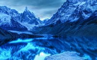 Serene Glacial Lake Surrounded by Majestic Mountain Range