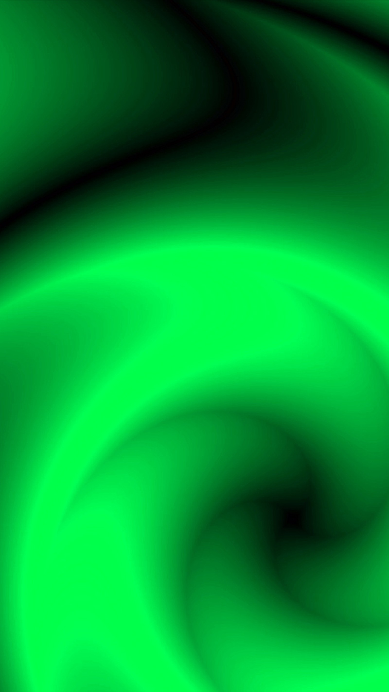 A close up of a green swirl with a black background (bright, cg, color, green, paint)