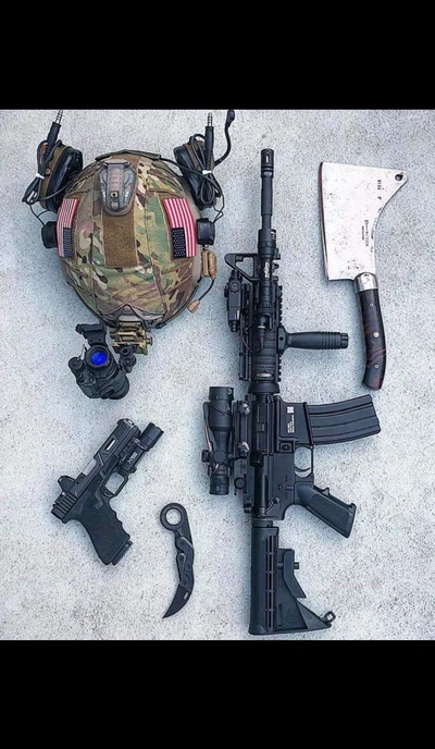 Military Gear and Firearms Display: A Tactical Arrangement of Weapons and Equipment