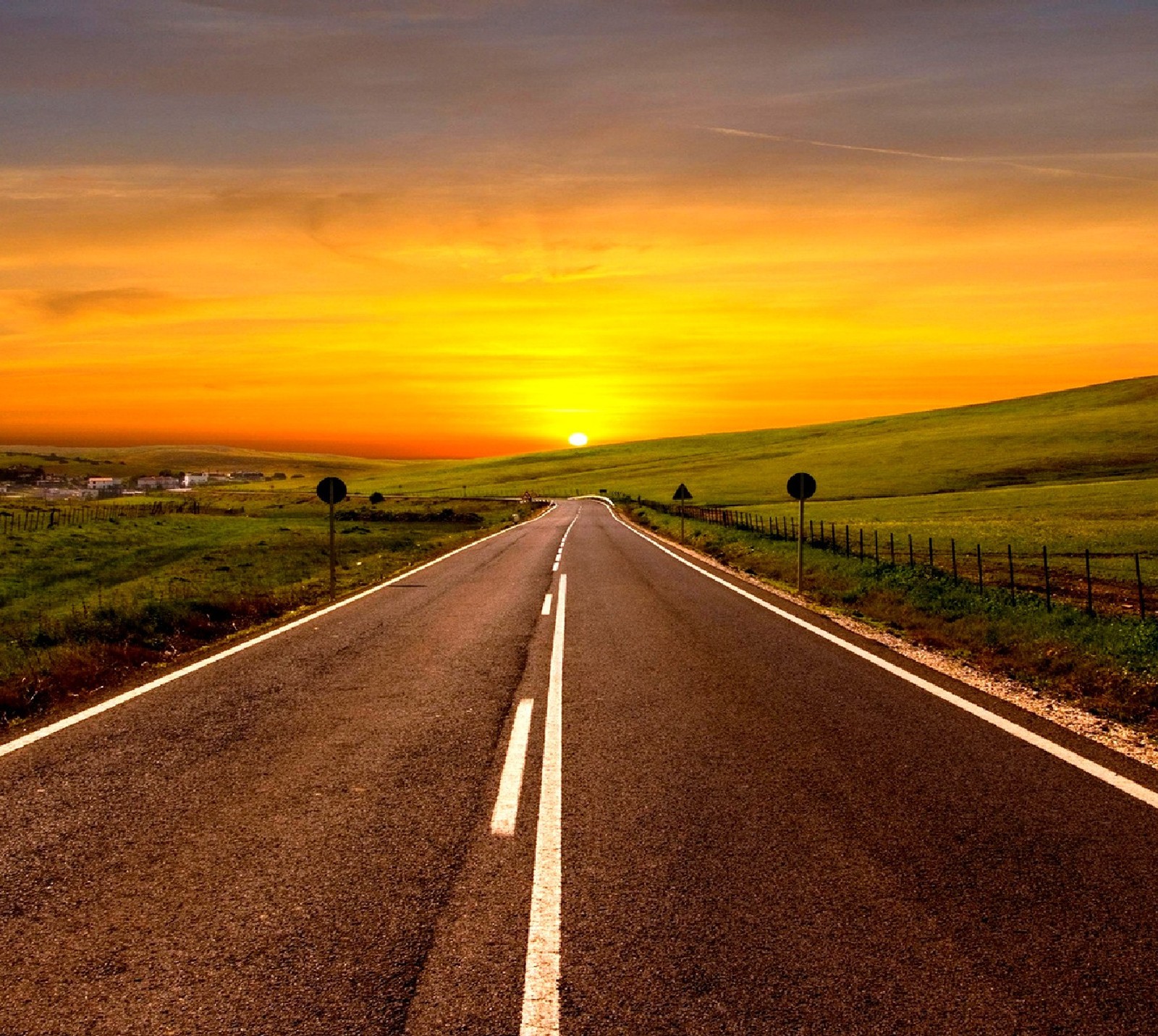 A close up of a road with a sunset in the background (nature)