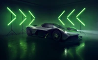 Aston Martin Valkyrie AMR Pro dans un cadre sombre avec un éclairage vert néon, mettant en valeur son design élégant et l'esthétique d'une hypercar.