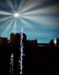 Urban Fountain Under Winter Sky with Light Reflection