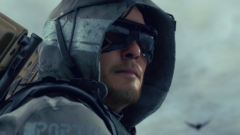 Крупный план мужчины в капюшоне и солнцезащитных очках (death stranding, видеоигра, норман ридус, norman reedus)