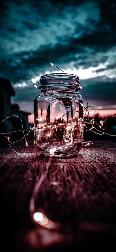 Illuminated Jar Against a Dramatic Sky