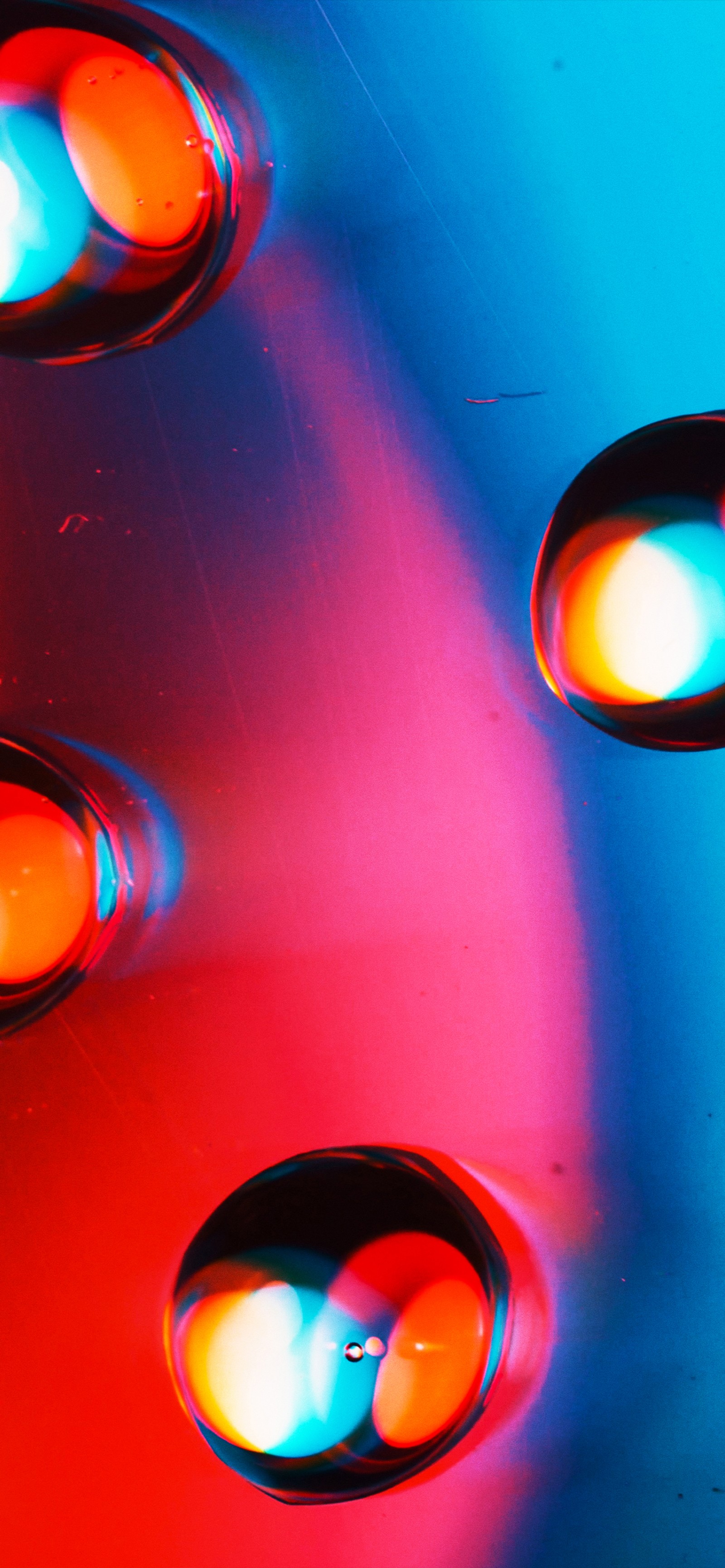 There are three lights that are on a red and blue surface (orange, colorfulness, light, automotive lighting, lighting)