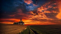 Majestuoso atardecer sobre un paisaje rústico con un viejo castillo