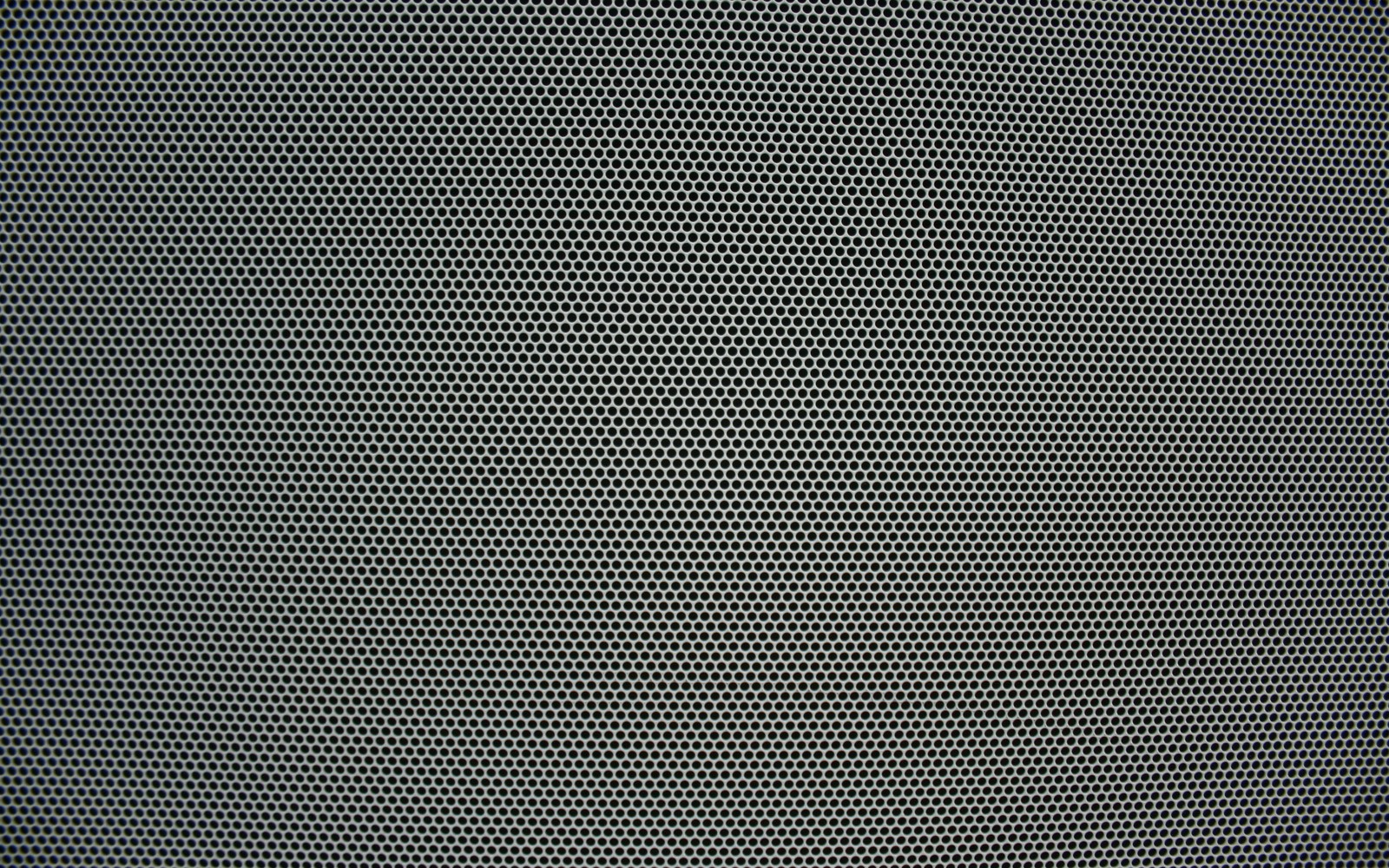 A close up of a black and white photo of a black and white wall (pattern, green, metal, line, mesh)