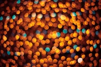 Vibrant Bokeh: A Pattern of Orange and Teal Circles