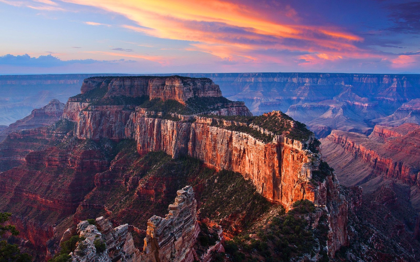 A view of the grand canyon at sunset from the rim of the grand canyon (grand canyon, grand canyon village, national park, canyon, formation)