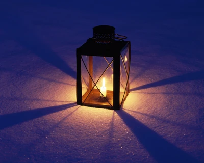 Warm Candlelight Glowing in Snowy Darkness