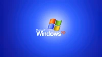 Windows XP Logo on Blue Background - 5K Technology Wallpaper