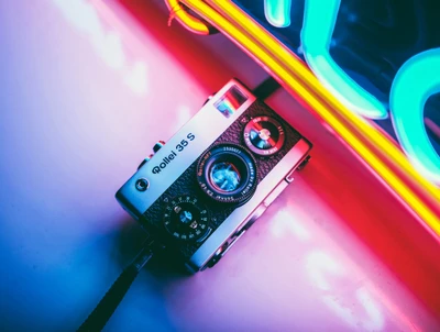 Close-Up of a Vintage Camera Against Neon Lights