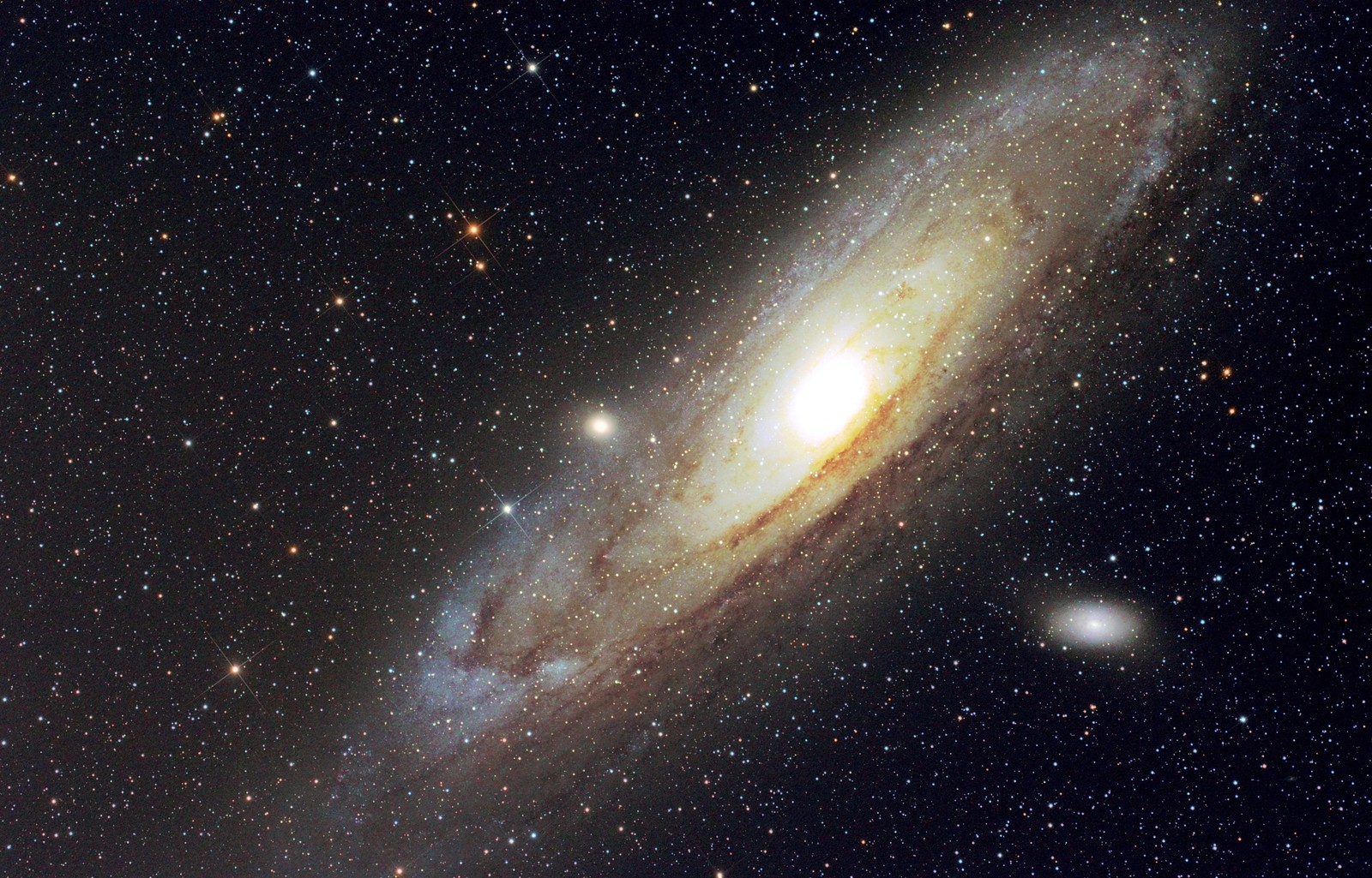 A close up of a spiral galaxy with a bright disk (andromeda galaxy, galaxy, astronomy, outer space, atmosphere)