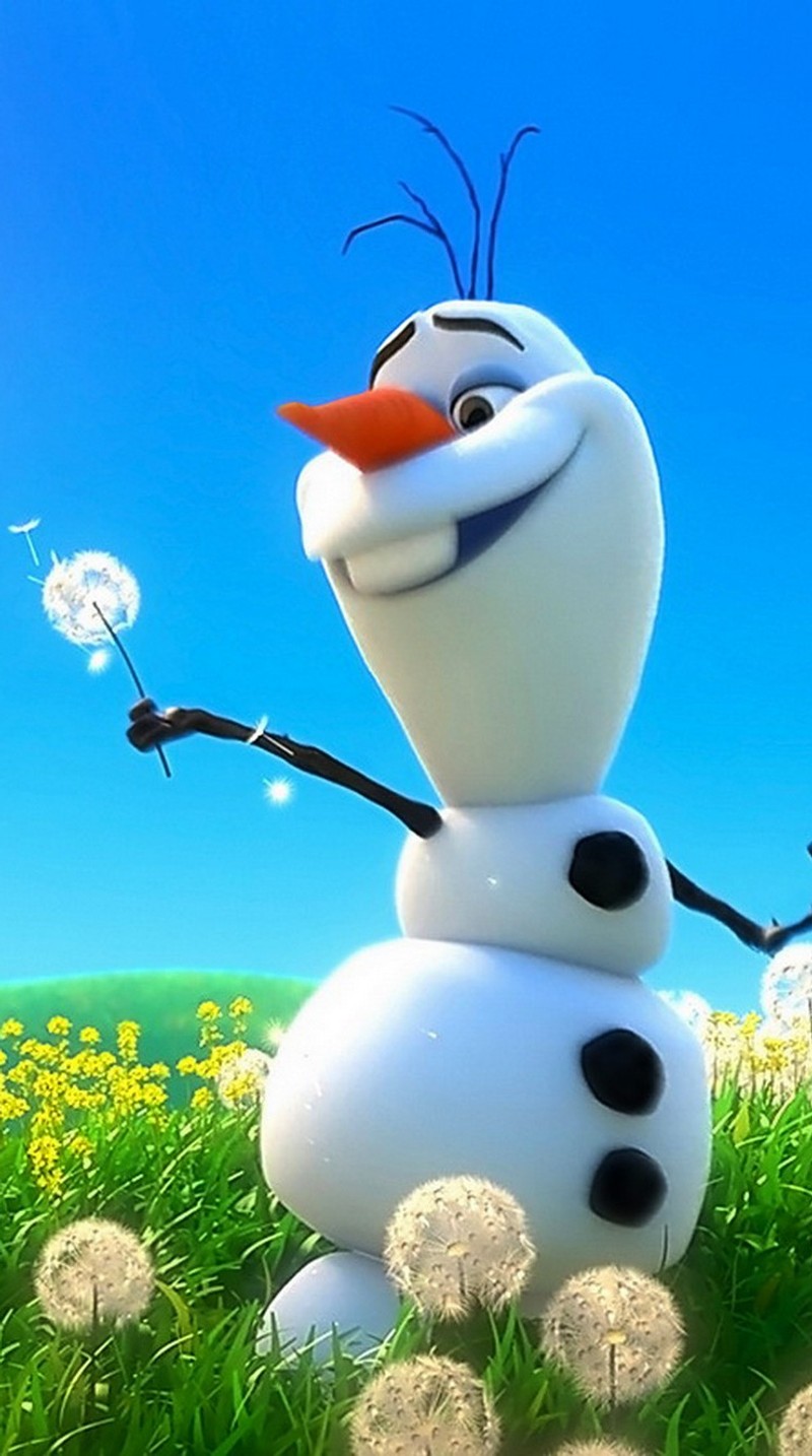 A close up of a snowman with a dandelion in his hand (abstract, frozen, happy, meadow, snowman)