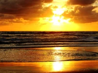 Golden Sunset Over Tranquil Waves