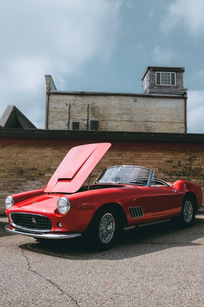 Classic Red Ferrari Convertible at Auto Show