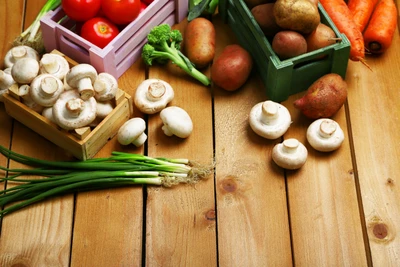 Fresh Organic Vegetables: Mushrooms, Potatoes, Tomatoes, and Broccoli on Rustic Wood