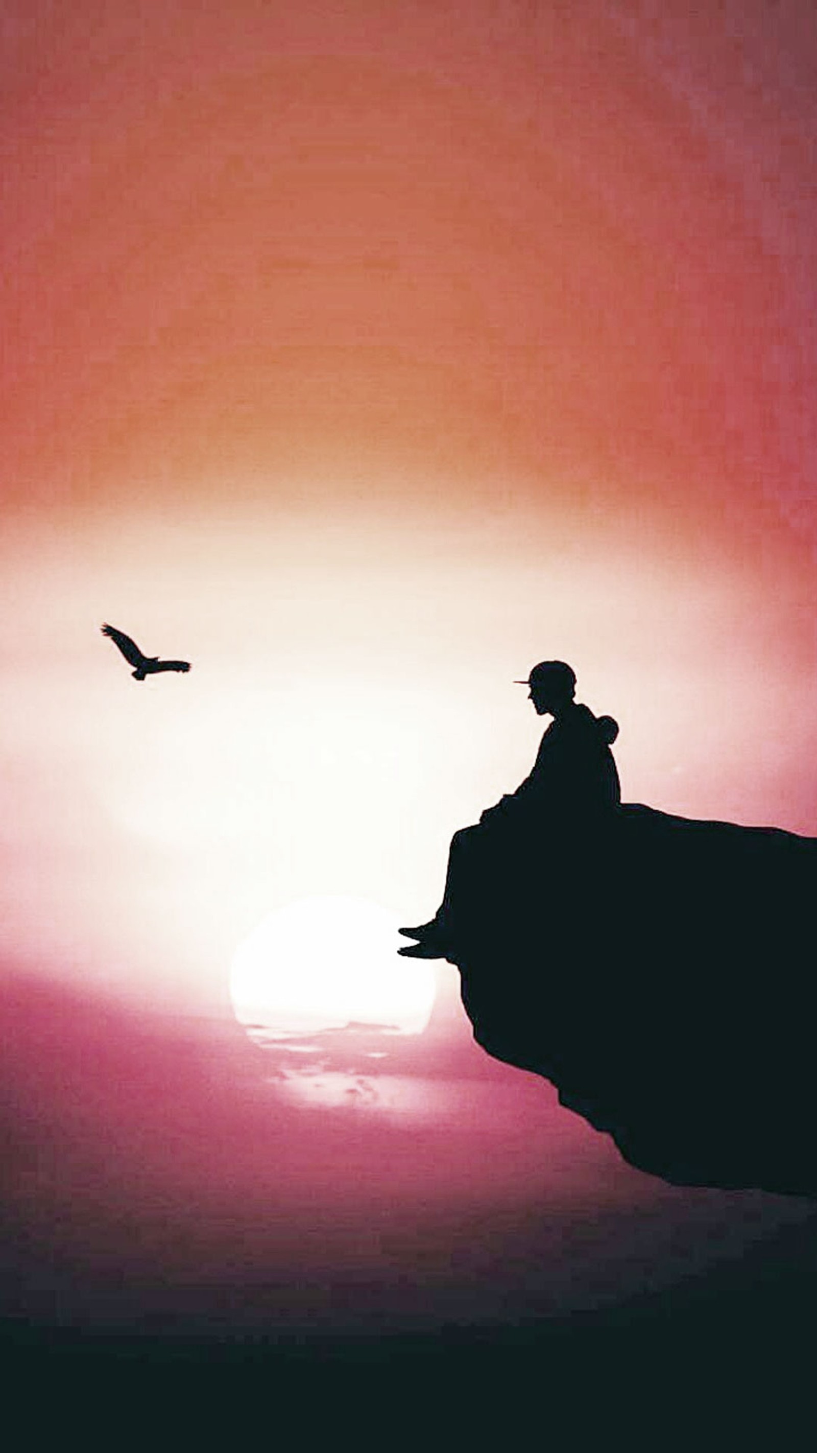 There is a man sitting on a cliff watching a bird fly by (black, cr7, dark, design, girl)