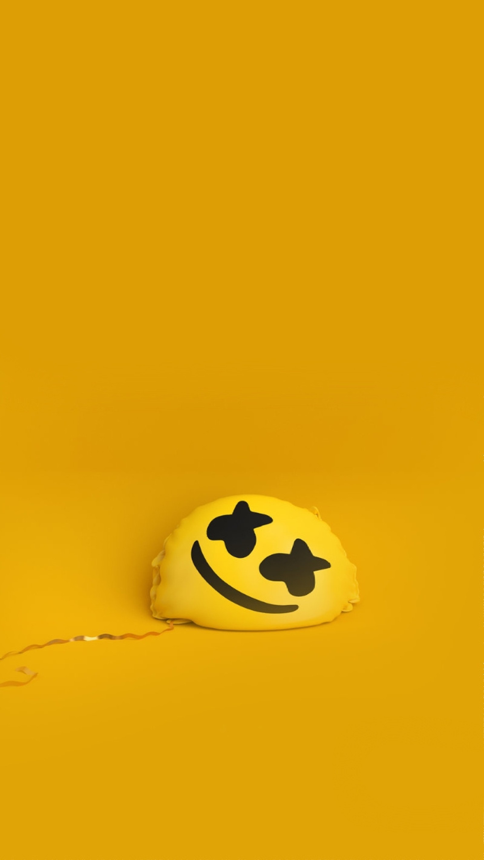 Yellow smiley face pillow with black eyes on a yellow background (marshmello, yellow)