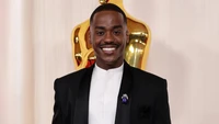 Ncuti Gatwa at the Oscars in a stylish black tuxedo, radiating confidence and charm.