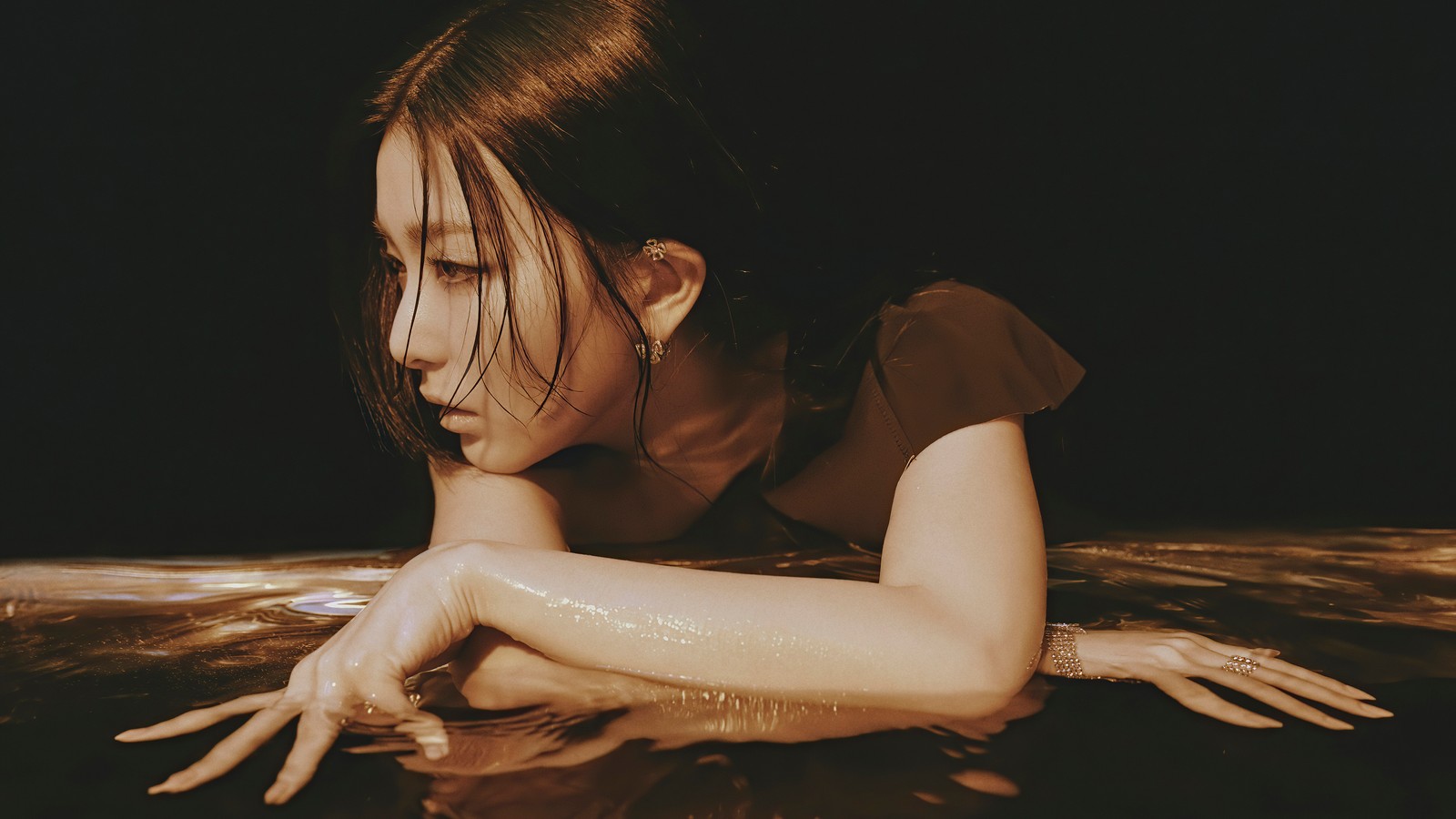 There is a woman that is laying down in the water (seulgi, 슬기, kang seul gi, 강슬기, red velvet)