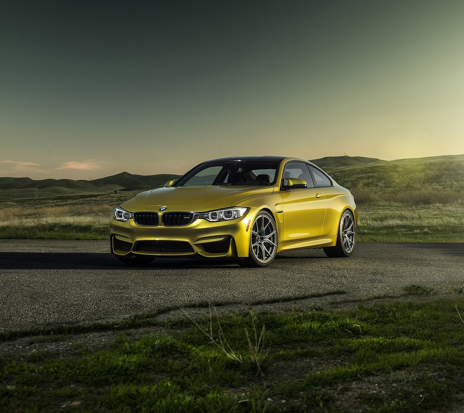 A yellow bmw car parked on a road in a field (bmw, coupe, m4, vorsteiner)