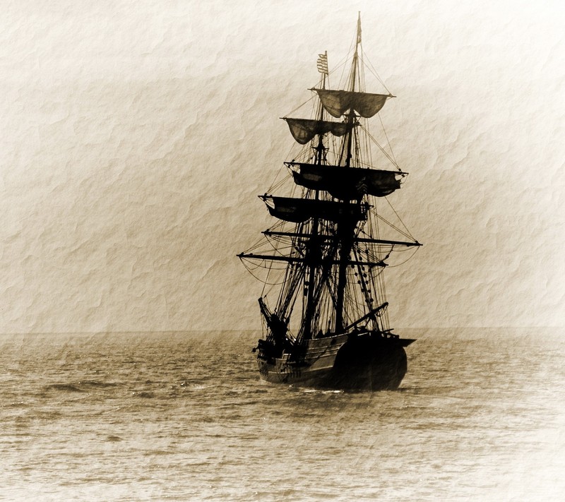 There is a black and white photo of a tall ship in the water (art, design)