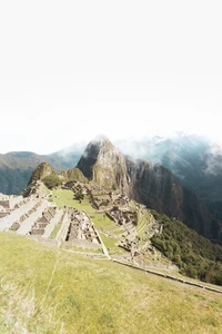 Machu Picchu: Ancient Inca Citadel Amidst Majestic Mountain Landscape.