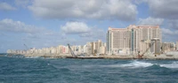 Coastal City Skyline Against a Dynamic Ocean Horizon