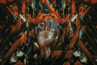 Contemporary Visual Art: Hand Emerging Among Vibrant Orange Seaweed and Leaves