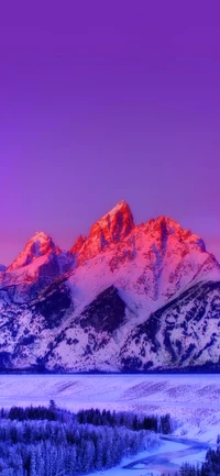 Grand Teton Mountain Range at Dusk: A Majestic Display of Snow-Capped Peaks and Vibrant Afterglow