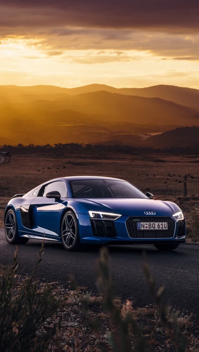 Audi R8 V10 vor einem dramatischen Sonnenuntergang.