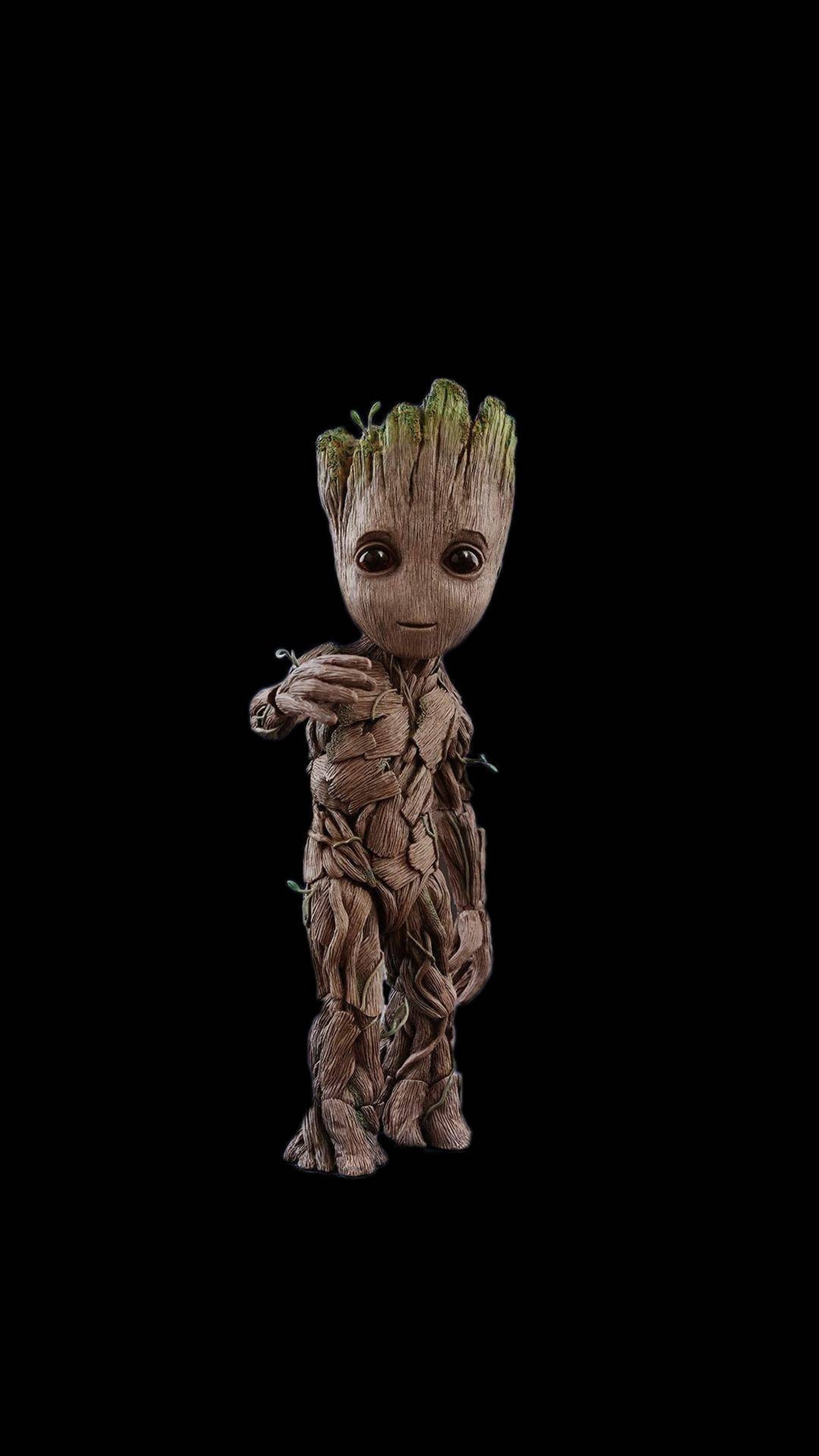 A close up of a small grooter with a black background (galaxy, groot, guardians)