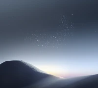 Serene Night Sky Over Mountain Landscape